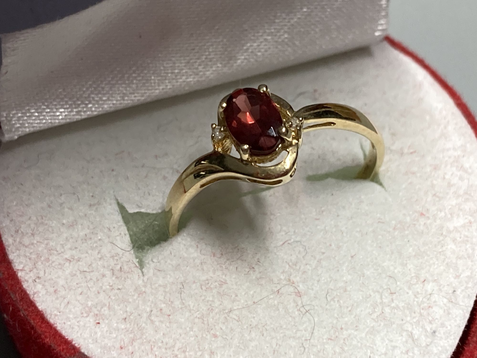 Three assorted modern 9ct gold or 9k gem set dress rings
